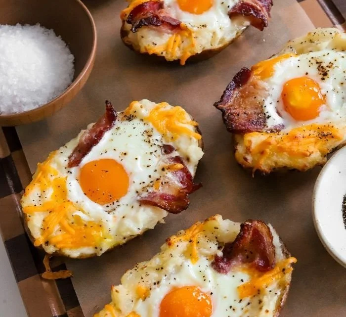 Twice baked loaded breakfast potatoes topped with cheese and green onions.
