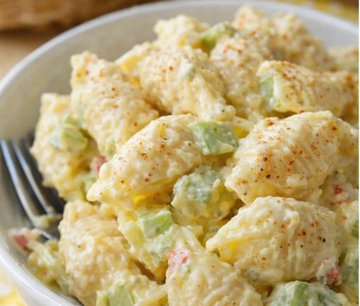 Bowl of colorful Amish Pasta Salad with fresh vegetables and dressing