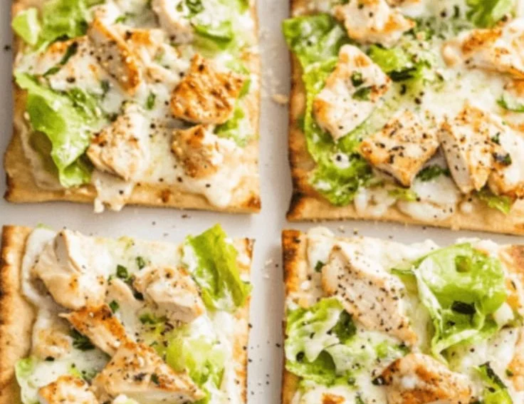 A delicious Chicken Caesar Flatbread with grilled chicken, romaine lettuce, and Caesar dressing.