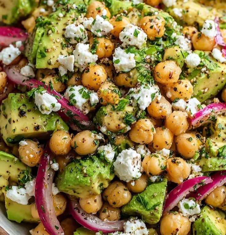 Chickpeas salad with feta cheese and avocado in a vibrant bowl