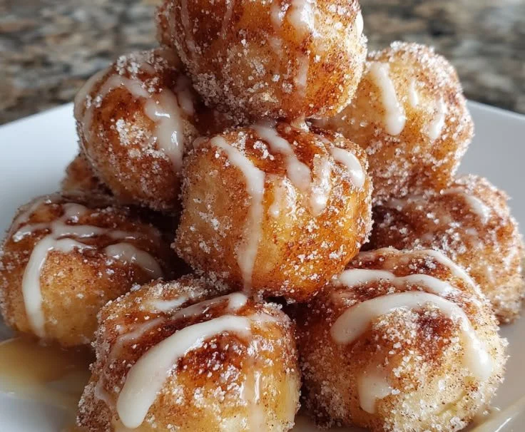 Plate of freshly baked Cinnamon Sugar Biscuit Bites with a sprinkle of cinnamon sugar