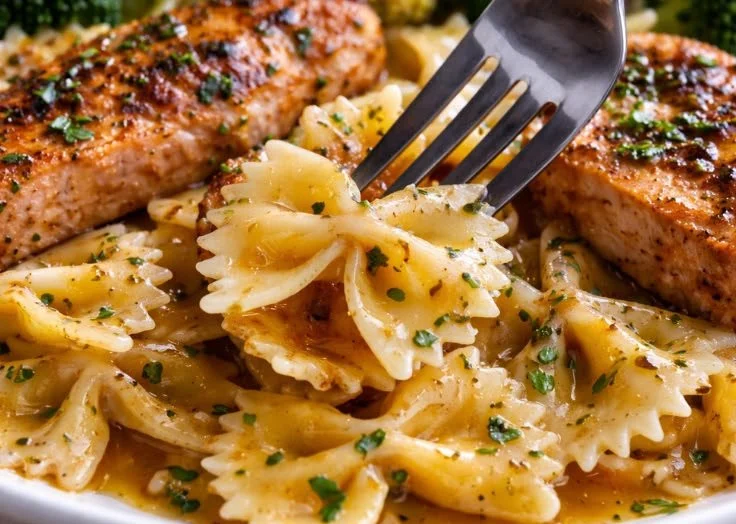 Cowboy Butter Lemon Chicken served with bowtie pasta and steamed broccoli