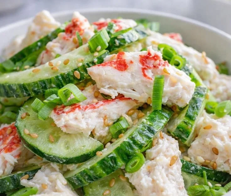 Fresh Cucumber Crab Salad with crab meat and sliced cucumbers served in a bowl.