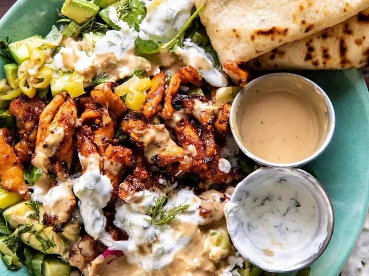 High-protein Mediterranean chicken bowls with fresh vegetables and grains