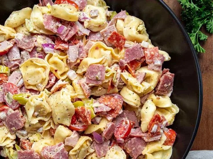 Italian Grinder Tortellini Salad with colorful vegetables and dressing