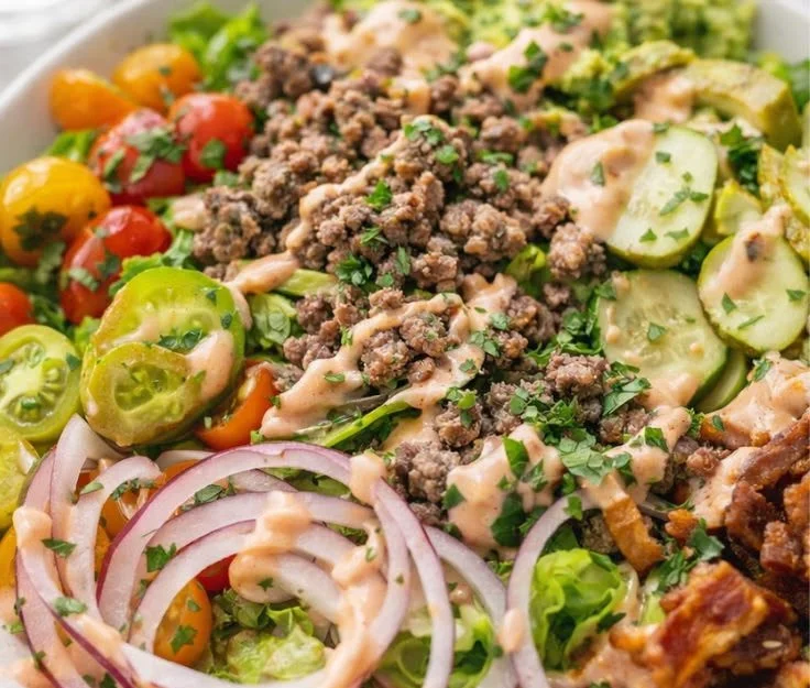Loaded Whole30 Burger Bowl served with special sauce for a healthy meal option