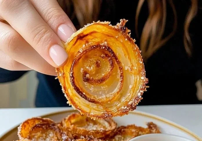 Low-carb baked onion rings served on a platter with dipping sauce