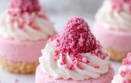 No-bake pink velvet cheesecake bites decorated for a sweet dessert display.