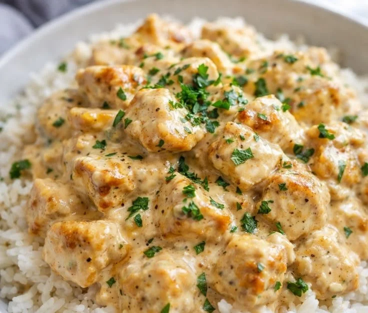 Delicious smothered chicken served over rice, ultimate comfort food dinner.