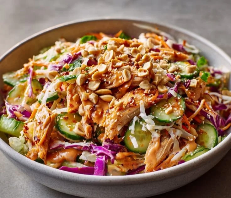 Bang Bang Chicken Salad with vibrant ingredients and a spicy dressing.