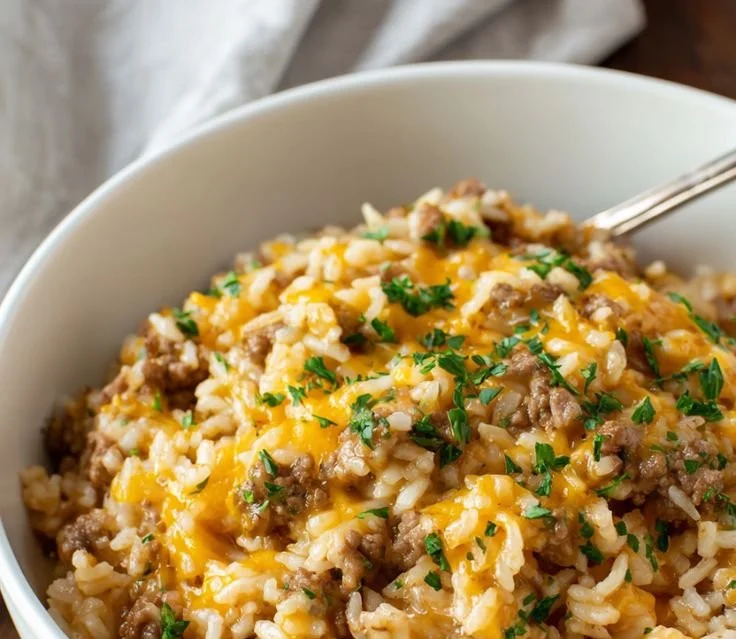 Delicious cheesy ground beef and rice casserole baked to perfection