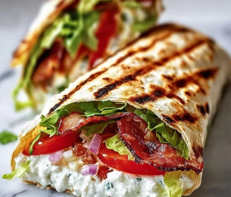 Cottage cheese wraps served on a wooden platter with fresh vegetables