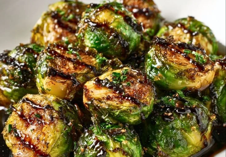 Delicious crispy Brussels sprouts drizzled with honey balsamic glaze.
