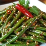Chinese buffet style green beans with vibrant colors and savory sauce