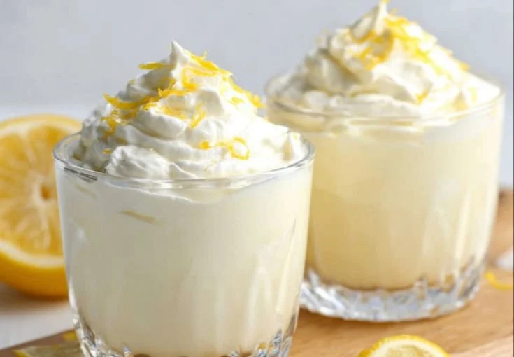 Delicious lemon cottage cheese pudding in a bowl, garnished with lemon zest.