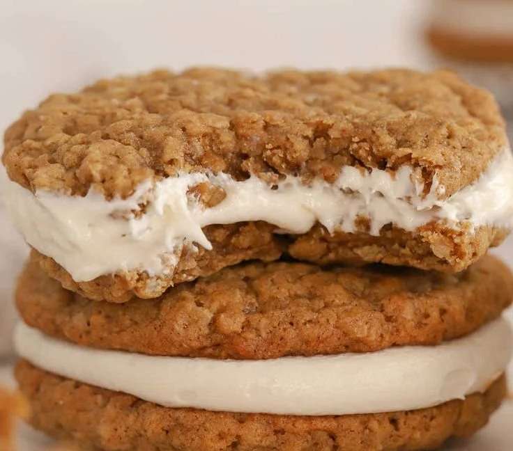 Homemade oatmeal cream pies with fluffy cream filling between chewy cookies.