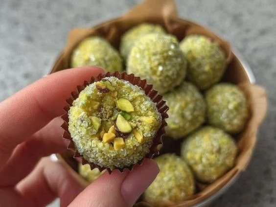 Delicious homemade Pistachio Brigadeiros arranged on a plate.