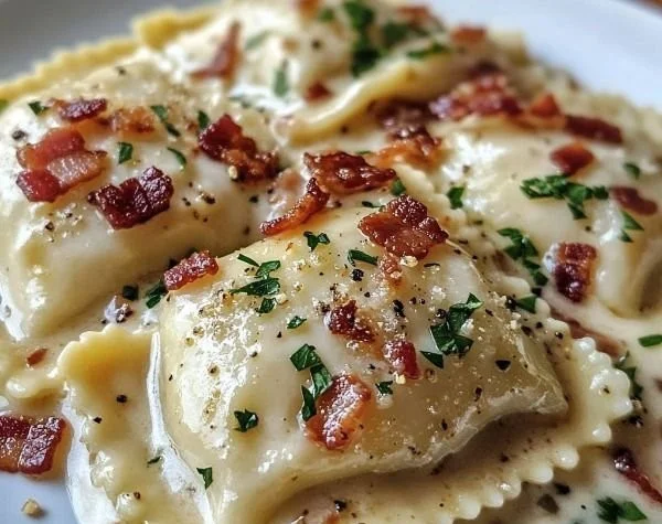 Delicious Ravioli Carbonara served at Olive Garden with creamy sauce.
