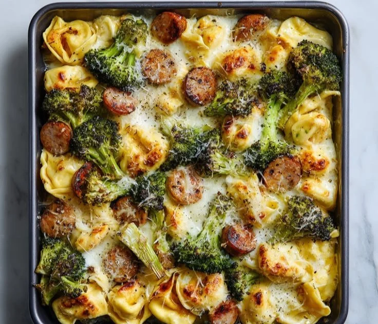 Sheet pan tortellini bake with broccoli served hot from the oven