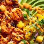Ultimate charred shrimp and avocado bowl topped with fresh ingredients
